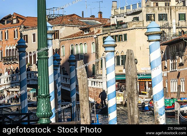 Venetian Paline de Casada (Venetian poles with stripes/mooring posts). The canals of Venice. Venice, Veneto Region, Italy, Europe