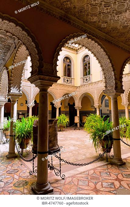 16th century palace with Arabian architecture, courtyard with artistic arcade and Roman mosaic, Palacio de la Condesa de Lebrija, Seville, Andalusia, Spain