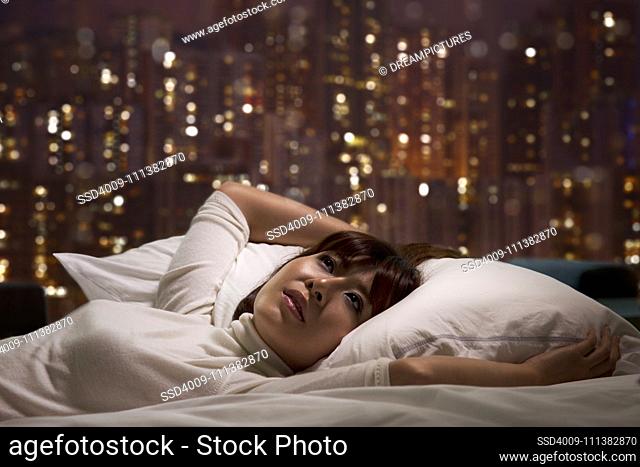Woman laying on bed