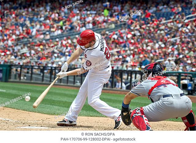 Washington Nationals second baseman Daniel Murphy (20) connects for a two R.B.I. single in the sixth inning against the New York Mets at Nationals Park in...