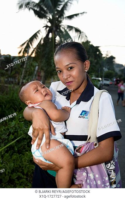 Woman holding her baby  Cebu City, Cebu, Visayas, Philippines