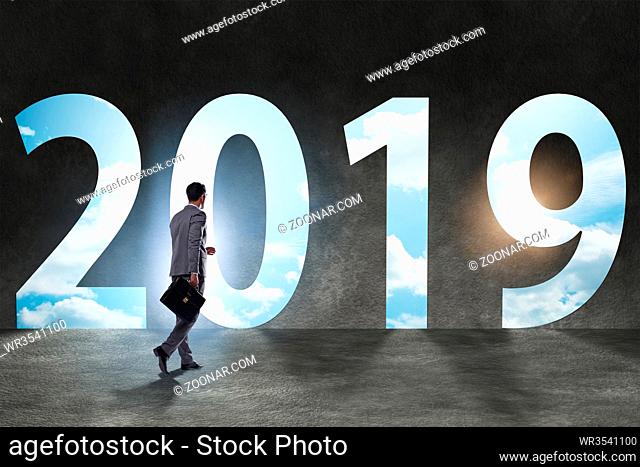 Businessman in the concept of transition to year 2019