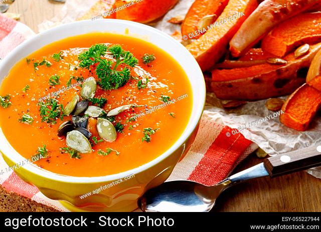 Homemade Thanksgiving Rustic Pumpkin Soup puree in ceramic Bowl