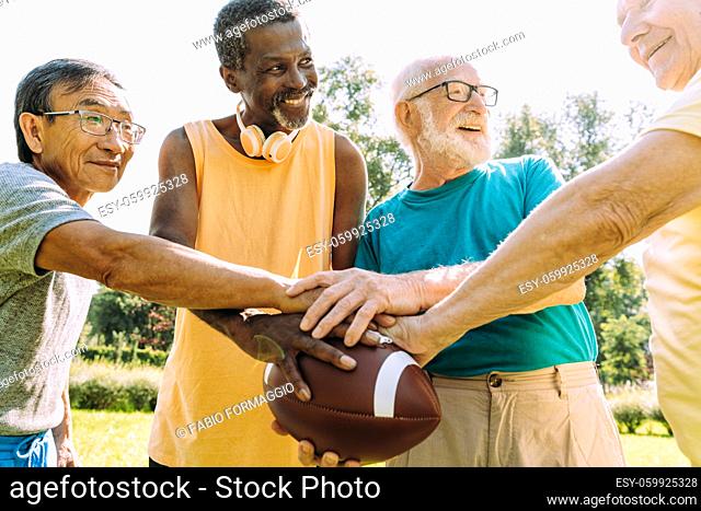 group of senior friends playing at the park. Lifestyle concepts about seniority and third age