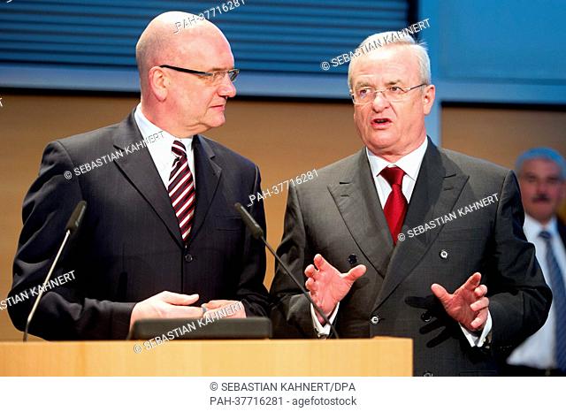 Volkswagen works council chairman Bernd Osterloh (L) and VW chairman of the board Martin Winterkorn speaks during the VW works meeting in Wolfsburg, Germany