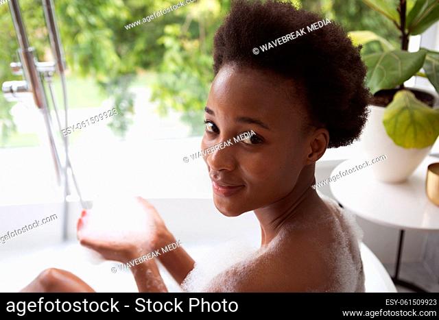 Portrait of woman in a bathtub