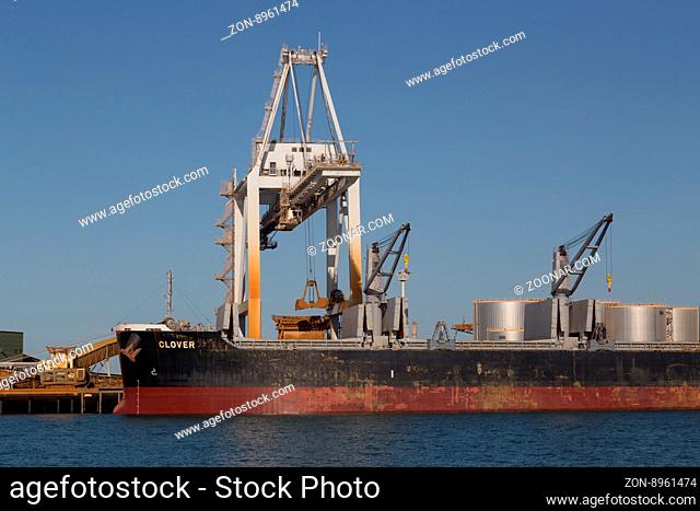 Townsville, Australia - May 11, 2015: Cargo ship is being unloaded at container terminal