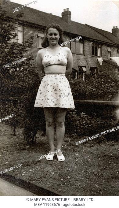 'Entitled 'The Body' - this photo shows a British Housewife in her back garden modelling her latest summer beach outfit - July, 1949.'