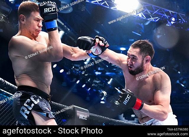 RUSSIA, YEKATERINBURG - DECEMBER 15, 2023: MMA fighters Maxim Grishin (L) of Russia and Asylzhan Bakhytzhanuly of Kazakhstan fight in their light heavyweight...