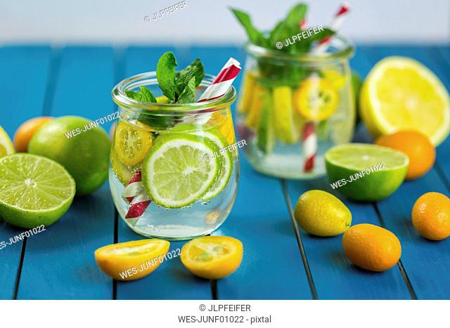 Infused water with lime, lemon, kumquat and mint