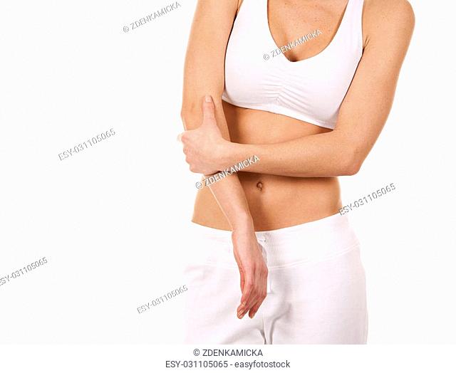 brunette holding her elbow on white isolated background