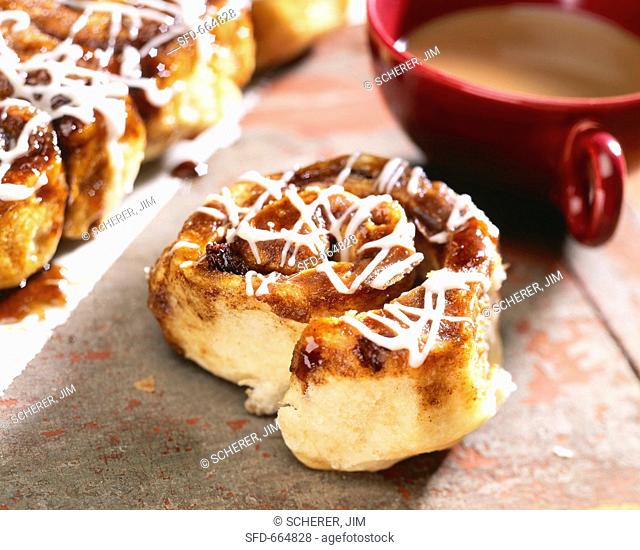 Cinnamon Sticky Bun with a Cup of Coffee