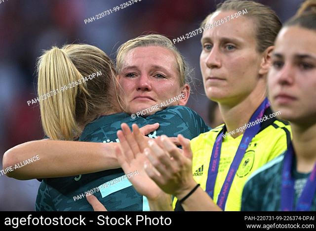 31 July 2022, Great Britain, London: Soccer, Women, Euro 2022, England - Germany, Final, Wembley Stadium: Germany's Alexandra Popp cries after being honored for...