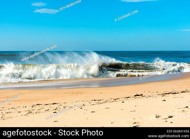 Wind and breaking surface waves on the beach of Granja in the south of Porto