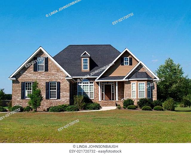 Small Two Story Brick Home with Garage and Porch
