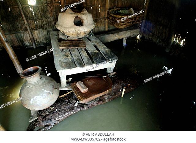A rural kitchen room surrounded by water Gaibandha, Bangladesh July 2004