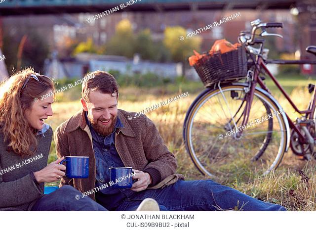 Couple enjoying coffee break on marshes