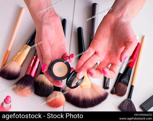 The collection of make up products displayed on the table