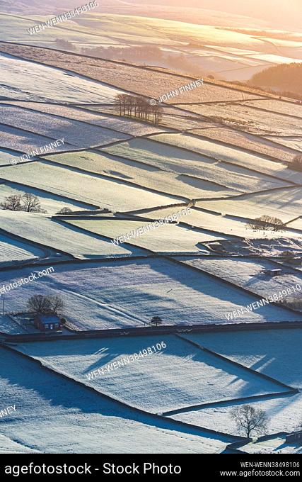 A frosty start at sunrise over the small Derbyshire village of Hayfield in the Peak District National park, Derbyshire, United Kingdom Featuring: Atmosphere...