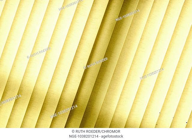Interior shot of a yellow blinds made amp 8203 amp 8203 of fabric in the back light