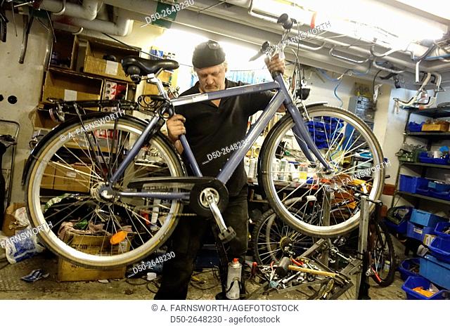 STOCKHOLM, SWEDEN Bicycle repairman in suburb of Fruängen