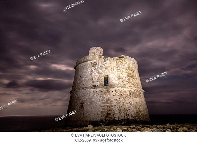The tower of Es Garroveret at night, close to the lighthouse of Es Cap de Barbaria. (Formentera, Balearic Islands)