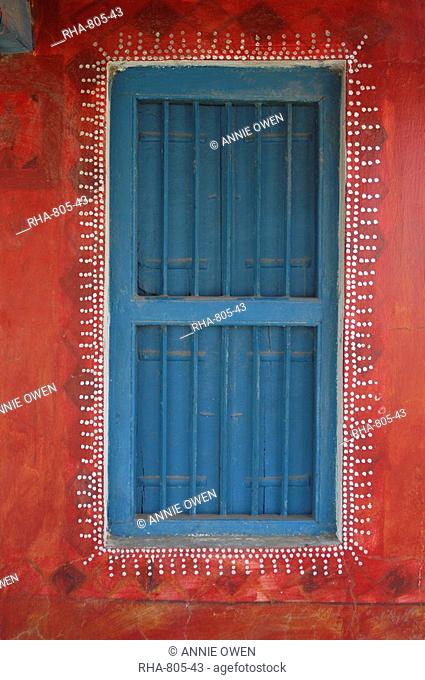 Decorated shuttered window in painted bhunga wall, Dhordo village, Kachchh, Gujarat, India, Asia