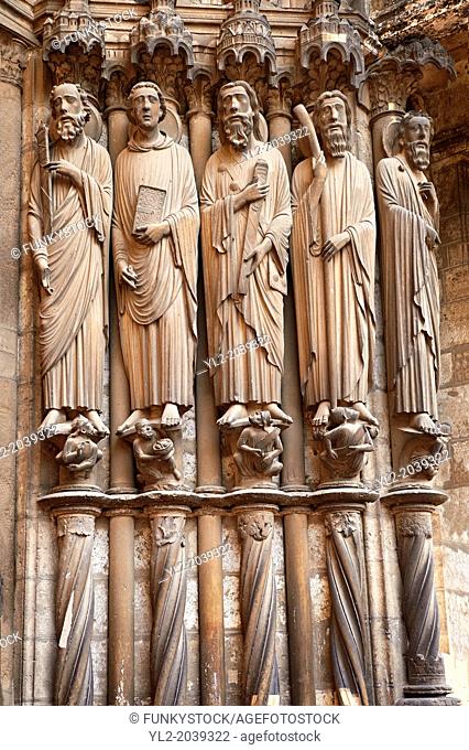South Porch right jam. Cathedral of Chartres, France. Gothic statue of the Apostles (haloed, carrying the instruments of their deaths)