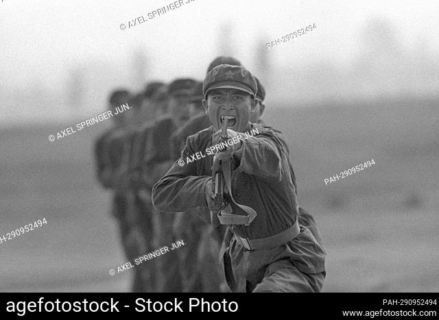 Chinese soldiers of the People's Liberation Army (PLA) train with rifles and bayonet on a training ground, black and white, black and white, black and white