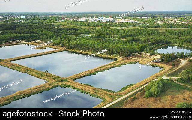 Aerial View Retention Basins, Wet Pond, Wet Detention Basin Or Stormwater Management Pond, Is An Artificial Pond With Vegetation Around The Perimeter