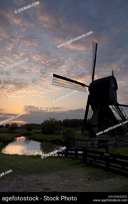 Windmill the Noordenveldse Molen seen just before sunset is situated between the Dutch villages Dussen en Almkerk in the province Noord-Brabant
