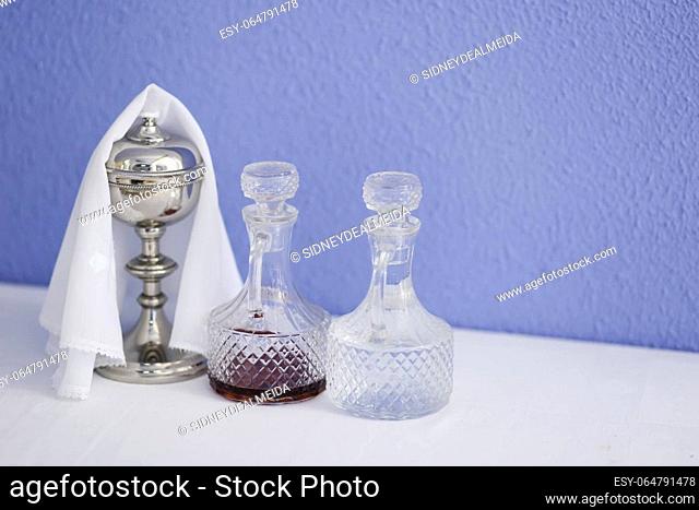 cruets with water and wine and chalice - religious objects