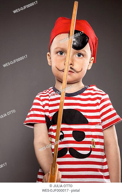 Little boy dressed as pirate