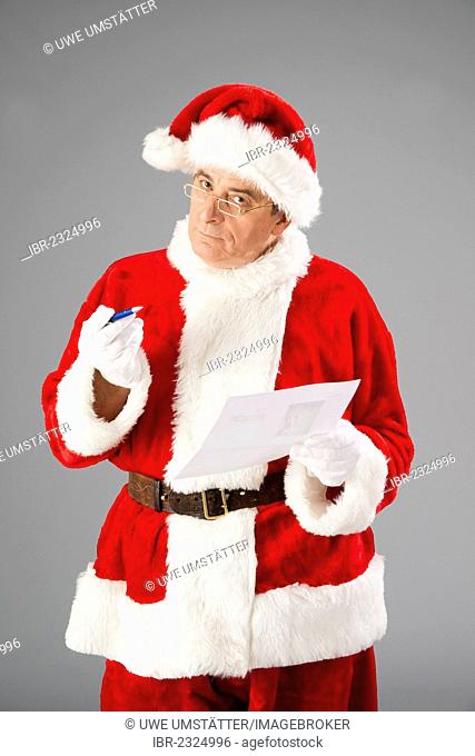 Santa Claus holding a list