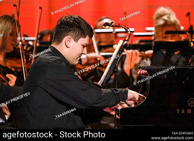 RUSSIA, MOSCOW - DECEMBER 5, 2023: Pianist Sergei Davydchenko performs during the opening of the 24th Nutcracker International Television Contest for Young...