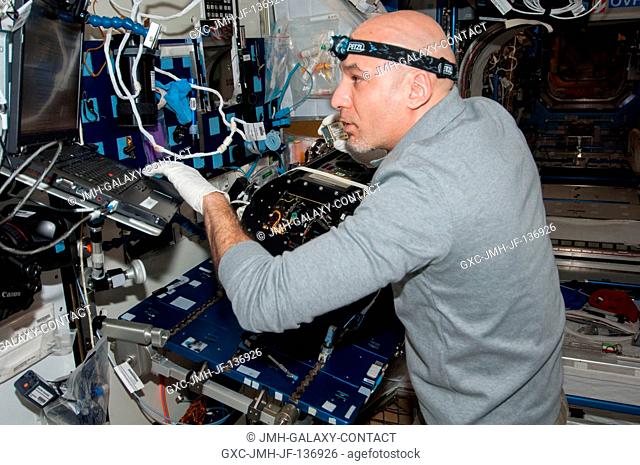 European Space Agency astronaut Luca Parmitano, Expedition 37 flight engineer, works on the Multi-User Droplet Combustion Apparatus (MDCA) Chamber Insert...