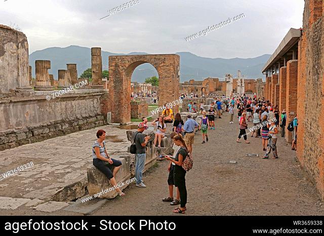 Pompei, Italy - June 25, 2014: Bunch of Tourists at Ancient Roman Temple Ruins World Heritage Site Near Naples, Italy