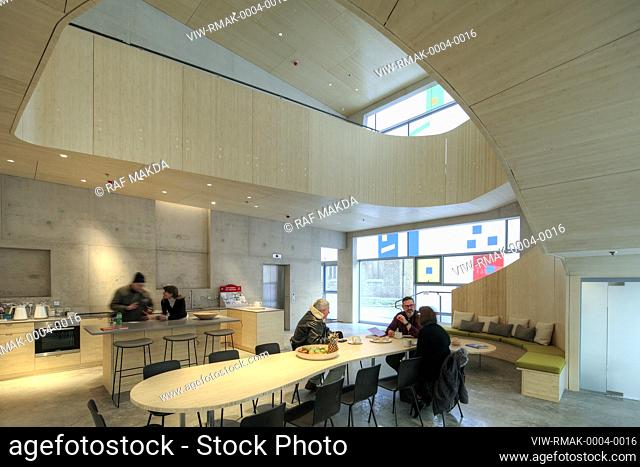 Communal kitchen area. Maggies Centre, St Bartholomews Hospital, EC1A 7BC, United Kingdom. Architect: Steven Holl Architects, 2017