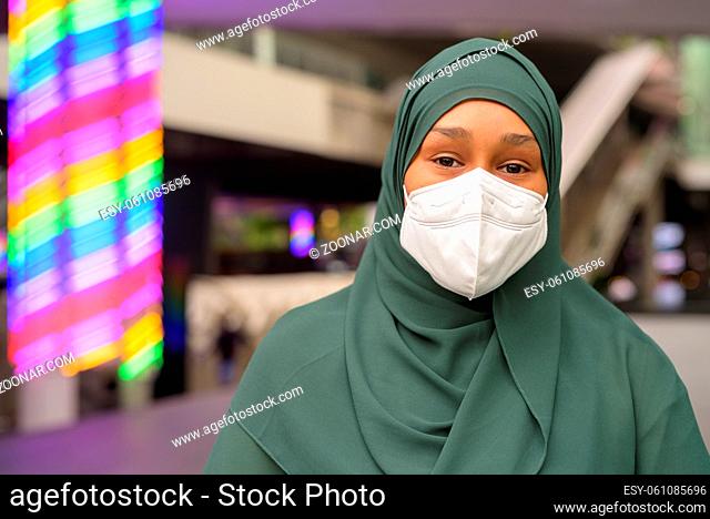 Portrait of beautiful black African Muslim woman outdoors