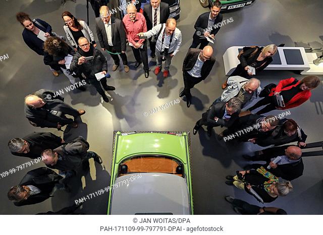 Visitors group around a Trabant driving simulator at the August Horch Museum in Zwickau, Germany, 9 November 2017. The museum has put together a new permanent...