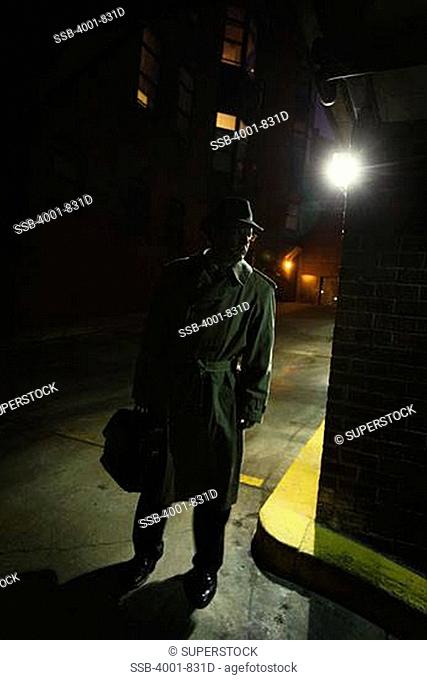 Silhouette of a spy standing on a street, Washington DC, USA