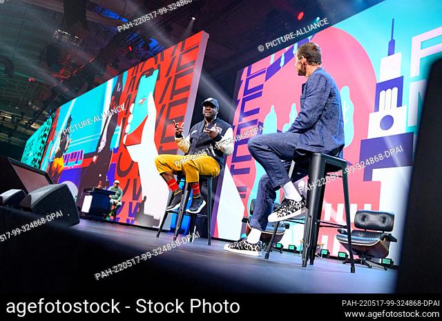 17 May 2022, Hamburg: Will.i.am (l), musician, music producer, entrepreneur and tech investor, is interviewed on a stage by presenter Kai Pflaume