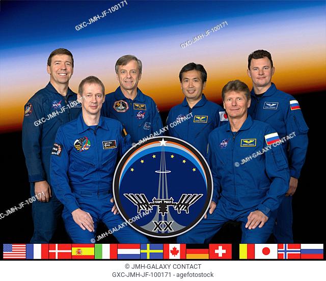 Expedition 20 crew members take a break from training at NASA's Johnson Space Center to pose for a crew portrait. From the right (front row) are cosmonaut...