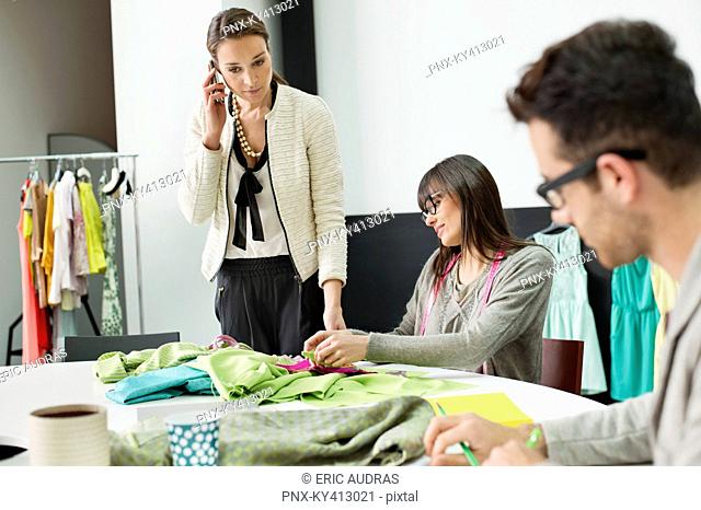 Fashion designers working in an office