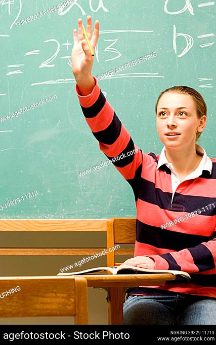 Female student with her hand raised