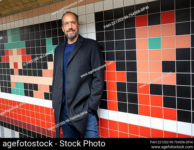 02 December 2022, Berlin: Illustrator Christoph Niemann stands in the newly designed pedestrian tunnel at Wannsee station