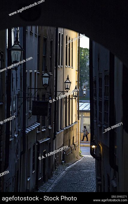 Stockholm, Sweden A pedestrian walks on Stora Hoparegrand on Gamla Stan or Old Town