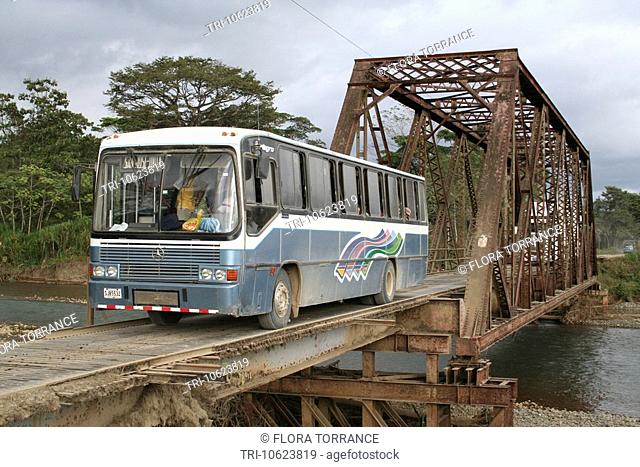 The Uvita to San JosŽ auto bus transport crosses an old steel bridge on southern Costa Rica pacific highway