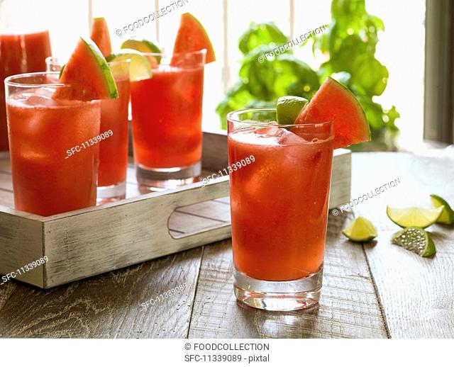 Watermelon cocktails on a rustic wooden tray