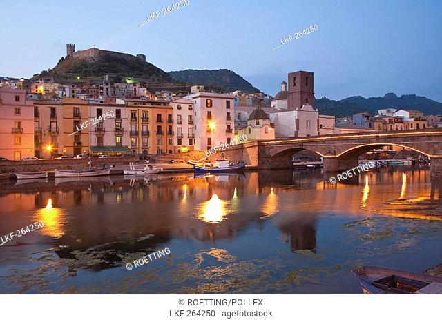 Bridge above the river Fiume Temo and the Castello di Serravalle at dusk, Bosa, Sardinia, Italy, Europe